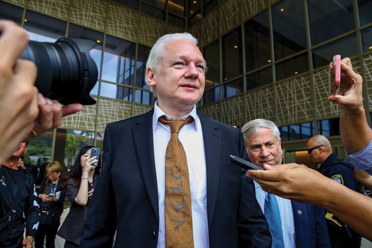 SAIPAN, NORTHERN MARIANA ISLANDS - JUNE 26: WikiLeaks founder Julian Assange leaves the United States Courthouse on June 26, 2024 in Saipan, Northern Mariana Islands. Julian Assange, the WikiLeaks founder, appeared before the U.S. District Court for the Northern Mariana Islands in Saipan on Wednesday for a change of plea hearing. Following his guilty plea to a felony charge under the Espionage Act, Assange was sentenced to time served and subsequently released, paving the way for his return to Australia as a free man, after years of incarceration and intense lobbying for his release from across the political spectrum. Assange's lawyer said that the work of WikiLeaks will continue "and Mr Assange, I have no doubt, will be a continuing force for freedom of speech and transparency in government," media reports said. (Photo by Chung Sung-Jun/Getty Images)